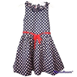 Savannah girls polka dot dress with tulle underneath and bow detailing